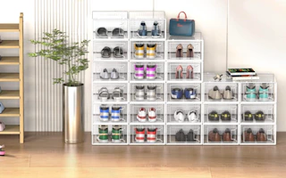 clear shoe boxes in a room against a wall