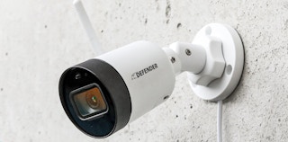 Walmart Defender Guard security camera mounted on a wall.