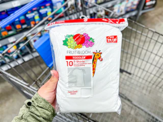 Toddler-sized Fruit of the Loom undershirt package held over Walmart shopping cart
