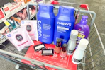 hask hair masks, harrys shampoo, maybelline eyeshadow, revlon nail polish, nexxus shampoo, and aussie hair treatment in a cart
