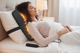 a woman with a back massager