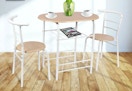 white metal and natural wood colored dining set