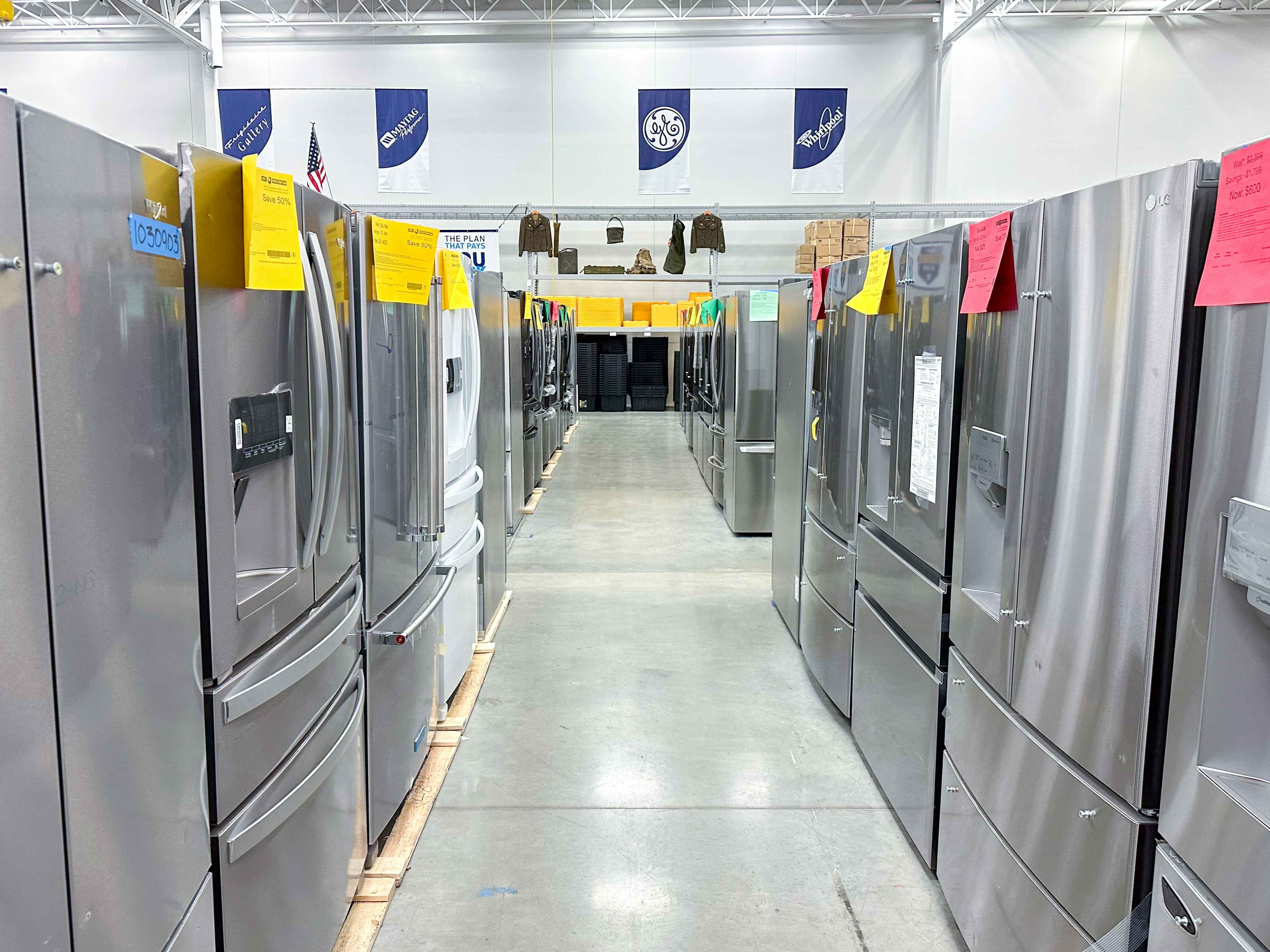 A row of discounted scratch and dent appliances at a Lowe's Outlet store