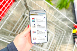 hand holding a smartphone displaying 1-clip coupons in the kcl app