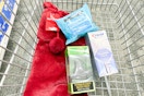 wicked bath bomb, crest whitening pen, and neutrogena makeup wipes with a christmas stocking in a cart