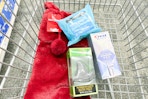 wicked bath bomb, crest whitening pen, and neutrogena makeup wipes with a christmas stocking in a cart