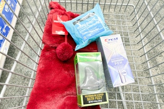 wicked bath bomb, crest whitening pen, and neutrogena makeup wipes with a christmas stocking in a cart