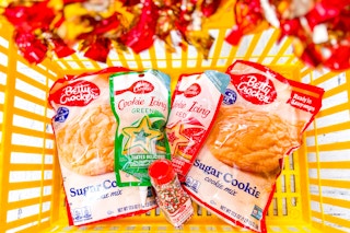 betty crocker cookie mix and icing in a yellow shopping basket