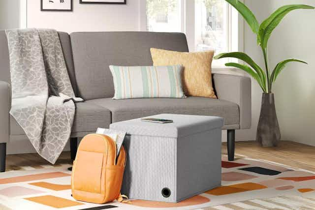 Score a Room Essentials Storage Ottoman for Only $23 at Target (Reg. $40) card image