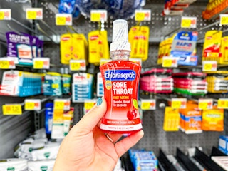 hand holding chloraseptic at walmart