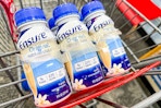 6-pack of ensure nutritional shakes in a cart