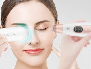 a person using a blackhead pore remover on their face