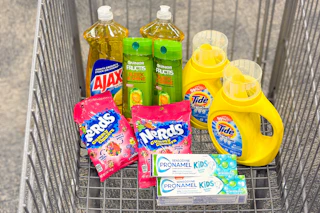 ajax dish soap, garnier shampoo, tide simply detergent, nerds gummy clusters, and sensodyne toothpaste in a cart