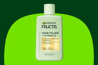 a green bottle of shampoo 