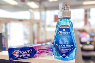 crest toothpaste and mouthwash on a shelf