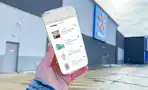 hand holding a smartphone displaying kcl 1-clip coupons