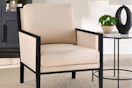 cream colored accent chair with black wood