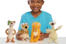 a boy with a set of four just play ice age plushies