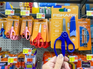 hand holding fiskars kids safety scissors at walmart
