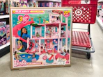 Barbie-dreamhouse-pool-party-doll-house in target aisle in front of cart