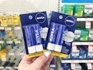 hand holding nivea lip balm 2-packs at target