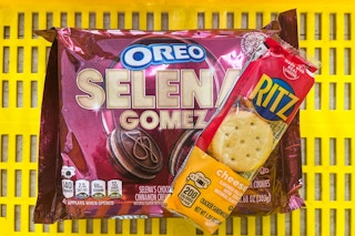selena gomez oreo and ritz crackers in a yellow shopping basket