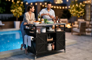 Lifestyle image of 2 people using a rolling grill cart outdoors by a pool (backyard setting)