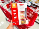 hand holding a rubbermaid 12-piece set over a target cart
