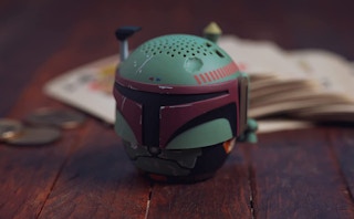 mini Star Wars bluetooth speaker on a wooden table