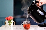 Black Ovente Electric Kettle (lifestyle image of water being poured to make a cup of tea)