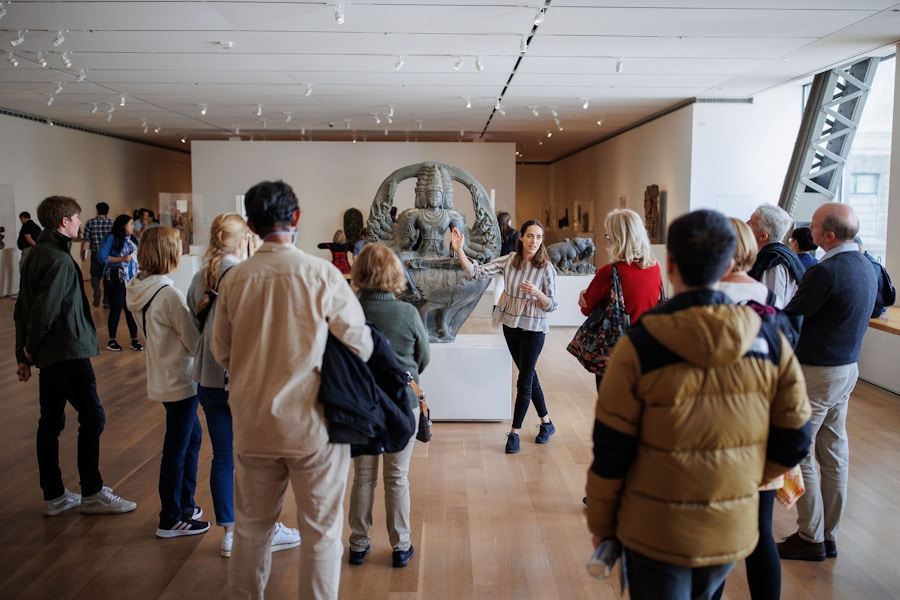 Someone leading a group tour through an exhibit at the Art Institute of Chicago