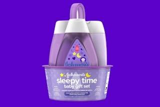 a purple caddy with three baby bath products in bottles
