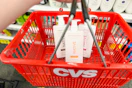 3 bottles of native shampoo in a red cvs basket