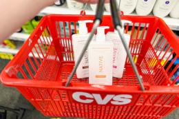 3 bottles of native shampoo in a red cvs basket