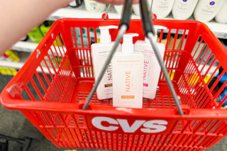 3 bottles of native shampoo in a red cvs basket