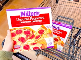 hand holding miltons pizza