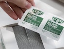 hand holding alcohol pads