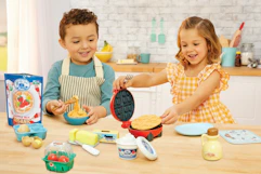 lifestyle image of children playing with a little tikes waffle playset
