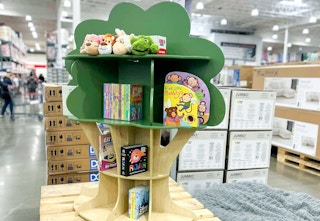 Costco delta children tree bookcase on display with books