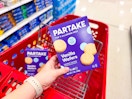 hand holding a box of partake vanilla wafers over a target cart