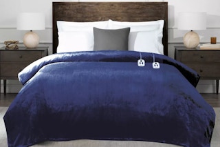 Brookstone Heated Twin Blanket on a bed with nightstand tables