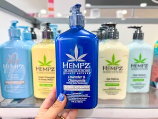 ulta hempz blue bottle lotion held in front of in store display 1685548183 1685548183