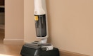 a wet dry vacuum mop against a wall