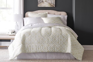 a comforter set on a bed