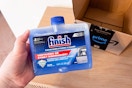Person holding Finish Dual Action over Prime box