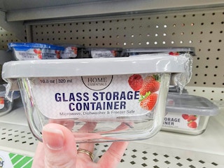 hand holding a glass food storage container