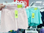 hand holding all-in-motion-kids-shorts at target