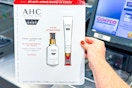 hand holding a pack of ahc skincare
