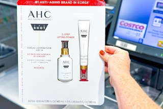 hand holding a pack of ahc skincare