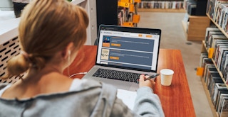 A college student looking up free textbooks on a website